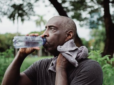Fitness water bottle and a towel on a bench.