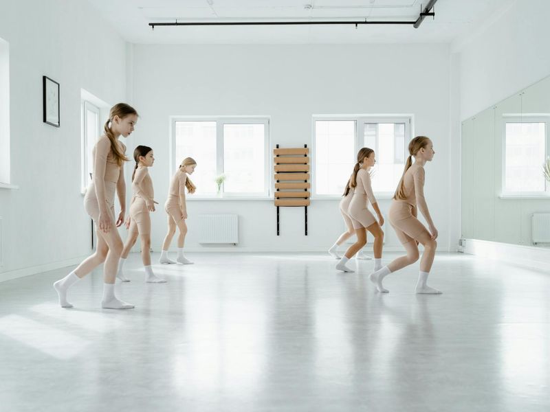 Person practicing active movements in a bright studio.